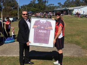 Brooke presents Shane his jersey!